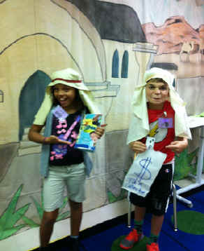 Children acting out the Pharisee and Tax Collector Bible story